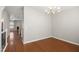 Cozy dining area offering hardwood floors, access to other rooms, and contemporary lighting at 711 Keystone Park Dr # 51, Morrisville, NC 27560