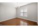 Well-lit dining area, with hardwood floors, a modern chandelier, and ample space for a large table at 711 Keystone Park Dr # 51, Morrisville, NC 27560