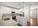 Well-appointed kitchen featuring granite countertops, stainless steel appliances, and a center island at 711 Keystone Park Dr # 51, Morrisville, NC 27560