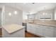 Bright kitchen with granite countertops, stainless steel appliances, pendant lighting and a seamless flow to living area at 711 Keystone Park Dr # 51, Morrisville, NC 27560