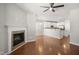 Inviting living room features a fireplace and opens to a modern kitchen with stainless steel appliances at 711 Keystone Park Dr # 51, Morrisville, NC 27560