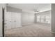 Spacious main bedroom featuring carpet, neutral paint, a closet, and large windows at 711 Keystone Park Dr # 51, Morrisville, NC 27560