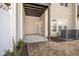 This covered patio offers a quiet space, with neutral siding and a well-maintained garden at 711 Keystone Park Dr # 51, Morrisville, NC 27560