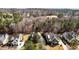 An aerial shot showcasing three beautiful homes nestled amongst lush trees in a quiet neighborhood at 818 Cabin Creek, Pittsboro, NC 27312