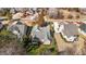 Overhead view of a gray home with manicured lawn, surrounded by trees and a driveway leading to the street at 818 Cabin Creek, Pittsboro, NC 27312