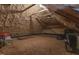 View of the attic featuring spray foam insulation, wooden beams, and subflooring at 818 Cabin Creek, Pittsboro, NC 27312