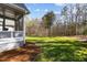 Expansive backyard featuring lush green lawn and wooded backdrop, creating a serene outdoor space at 818 Cabin Creek, Pittsboro, NC 27312