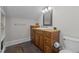 Bathroom featuring a single sink vanity with a dark wood cabinet and slate floors at 818 Cabin Creek, Pittsboro, NC 27312