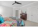 Cozy bedroom with a colorful bedspread, vintage furniture, and ample natural light, ideal for relaxation at 818 Cabin Creek, Pittsboro, NC 27312