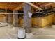 Crawl space featuring concrete supports, exposed ceiling joists and an encapsulated moisture barrier at 818 Cabin Creek, Pittsboro, NC 27312