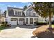 Charming two-story home with a two-car garage and inviting covered porch at 818 Cabin Creek, Pittsboro, NC 27312
