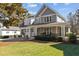 Gorgeous two-story home with a covered porch, two-car garage, and beautifully landscaped front yard at 818 Cabin Creek, Pittsboro, NC 27312