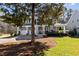Elegant home featuring a covered porch, two-car garage, and a meticulously landscaped yard at 818 Cabin Creek, Pittsboro, NC 27312
