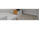 Bright home office with a white desk, wooden chair, and filing cabinet at 818 Cabin Creek, Pittsboro, NC 27312
