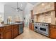 A gourmet kitchen features custom cabinets, granite countertops, and a Viking range and hood at 818 Cabin Creek, Pittsboro, NC 27312