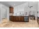 Open kitchen with modern appliances seamlessly connects to the dining and living areas at 818 Cabin Creek, Pittsboro, NC 27312