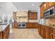 Gourmet kitchen with stainless steel appliances and custom cabinetry at 818 Cabin Creek, Pittsboro, NC 27312