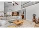 Open-concept living room with vaulted ceilings, seamlessly flowing into the kitchen area at 818 Cabin Creek, Pittsboro, NC 27312