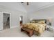 Large main bedroom with a vaulted ceiling, ensuite bathroom, and walk-in closet entrances at 818 Cabin Creek, Pittsboro, NC 27312