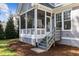 Close up view of the screened-in porch and steps from the backyard at 818 Cabin Creek, Pittsboro, NC 27312