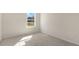 Bright bedroom with a large window offering natural light, enhanced by neutral paint and plush carpet at 870 Old Tarboro Rd, Wendell, NC 27591