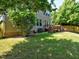 Spacious backyard with a deck, lush lawn and mature trees, ideal for outdoor living at 905 Maynard Creek Ct, Cary, NC 27513