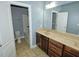 Bathroom featuring a double vanity, tile flooring, and shower-tub combo at 905 Maynard Creek Ct, Cary, NC 27513