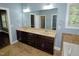 Bathroom featuring double vanity, bathtub, and large mirror at 905 Maynard Creek Ct, Cary, NC 27513