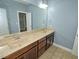 Bathroom featuring a double vanity, tile flooring, and neutral walls at 905 Maynard Creek Ct, Cary, NC 27513