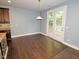Dining area with hardwood floors and double doors to outside deck at 905 Maynard Creek Ct, Cary, NC 27513