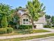 Charming home featuring stone accents, lush landscaping, and an attached garage at 905 Maynard Creek Ct, Cary, NC 27513
