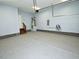 View of the spacious attached garage with speckled floor at 905 Maynard Creek Ct, Cary, NC 27513
