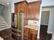 Kitchen featuring stainless steel refrigerator and dark wood cabinetry at 905 Maynard Creek Ct, Cary, NC 27513