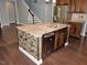 Kitchen island featuring granite countertops, a sink, dishwasher and mosaic tile accents at 905 Maynard Creek Ct, Cary, NC 27513