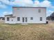 The backyard shows a large, grassy area, perfect for outdoor activities at 1009 Bittbourg Ln, Wendell, NC 27591