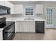 The kitchen features white cabinets and modern appliances at 1009 Bittbourg Ln, Wendell, NC 27591
