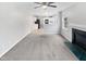 Bright living room with a fireplace and seamless flow to the adjacent kitchen area at 1009 Bittbourg Ln, Wendell, NC 27591