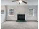 Living room showing windows and a fireplace at 1009 Bittbourg Ln, Wendell, NC 27591