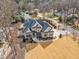 Stunning aerial view of a well-maintained home with lush landscaping and a welcoming entrance at 1100 Kingwood Dr, Raleigh, NC 27609