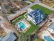 A well-maintained home with lush green landscaping, a refreshing pool, and solar panels on the roof at 1100 Kingwood Dr, Raleigh, NC 27609