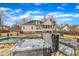 Beautiful home exterior featuring a hot tub, screened porch, solar panels, and meticulously landscaped backyard at 1100 Kingwood Dr, Raleigh, NC 27609