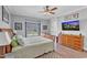 Inviting bedroom with a large window, wood floors, and ample natural light at 1100 Kingwood Dr, Raleigh, NC 27609