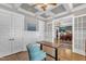 Bright home office with coffered ceilings, large windows, and modern furnishings at 1100 Kingwood Dr, Raleigh, NC 27609