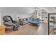 Bright living room with a cozy seating area, built-in bookshelves, and hardwood floors at 1100 Kingwood Dr, Raleigh, NC 27609
