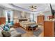 Serene main bedroom with tray ceilings, hardwood floors, and comfortable seating area at 1100 Kingwood Dr, Raleigh, NC 27609