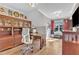 Well-appointed home office with custom cabinetry, a large desk, and a bright window at 1100 Kingwood Dr, Raleigh, NC 27609