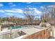Outdoor kitchen area featuring a built-in sink, stainless steel grill, and a view of the backyard at 1100 Kingwood Dr, Raleigh, NC 27609