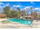 Inviting backyard pool area with sparkling water, a hot tub, and patio space perfect for entertaining at 1100 Kingwood Dr, Raleigh, NC 27609