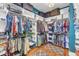 Organized walk-in closet with ample hanging space, shelves, and storage for clothes and accessories at 1100 Kingwood Dr, Raleigh, NC 27609