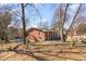 A view of the exterior showcasing the home's design, back yard, and surroundings at 114 Evelyn Dr, Knightdale, NC 27545